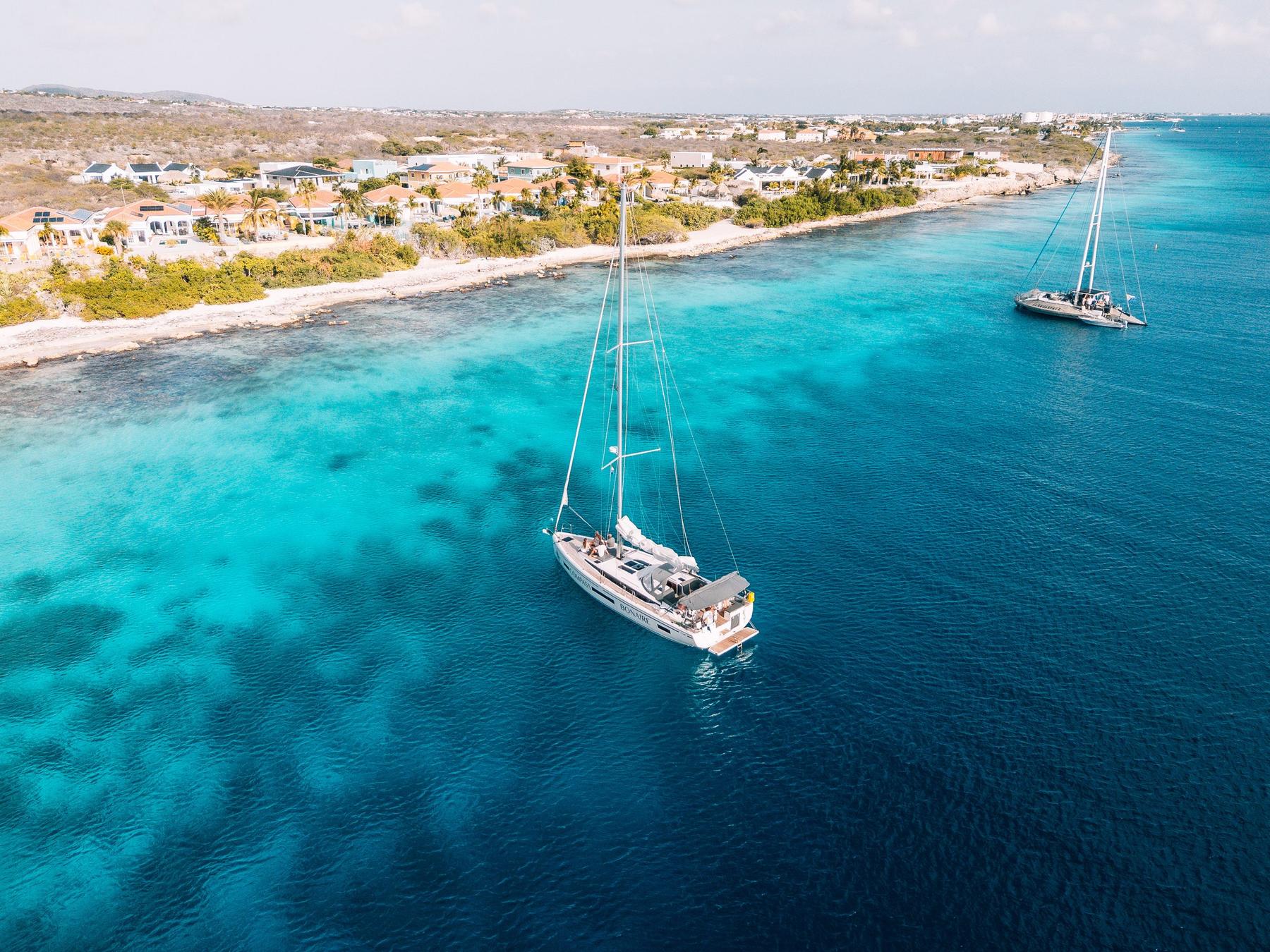The Compass Bonaire anchored off the Bonaire coast in turquoise water