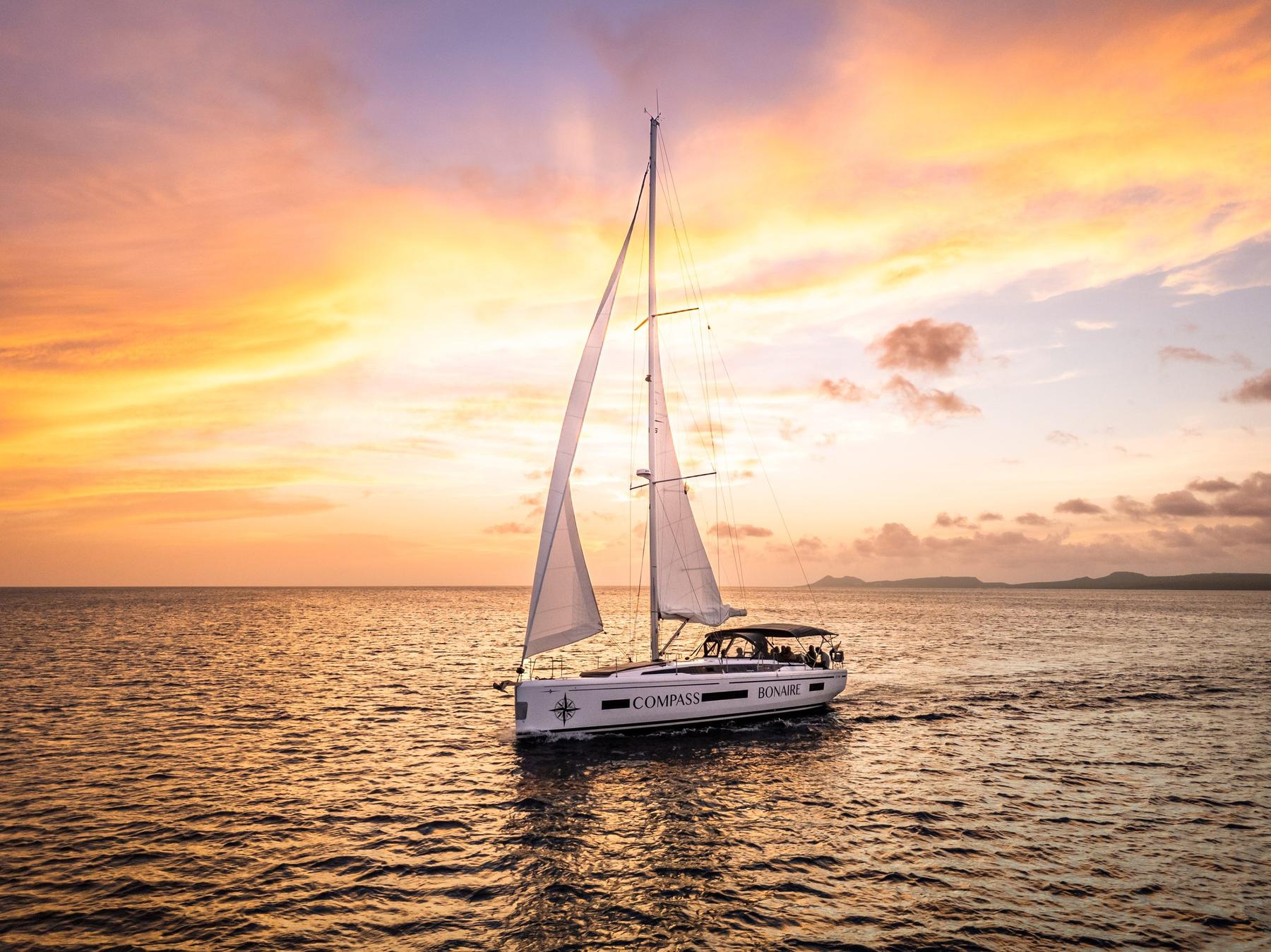 The Compass Bonaire silhouetted against a Caribbean sunset